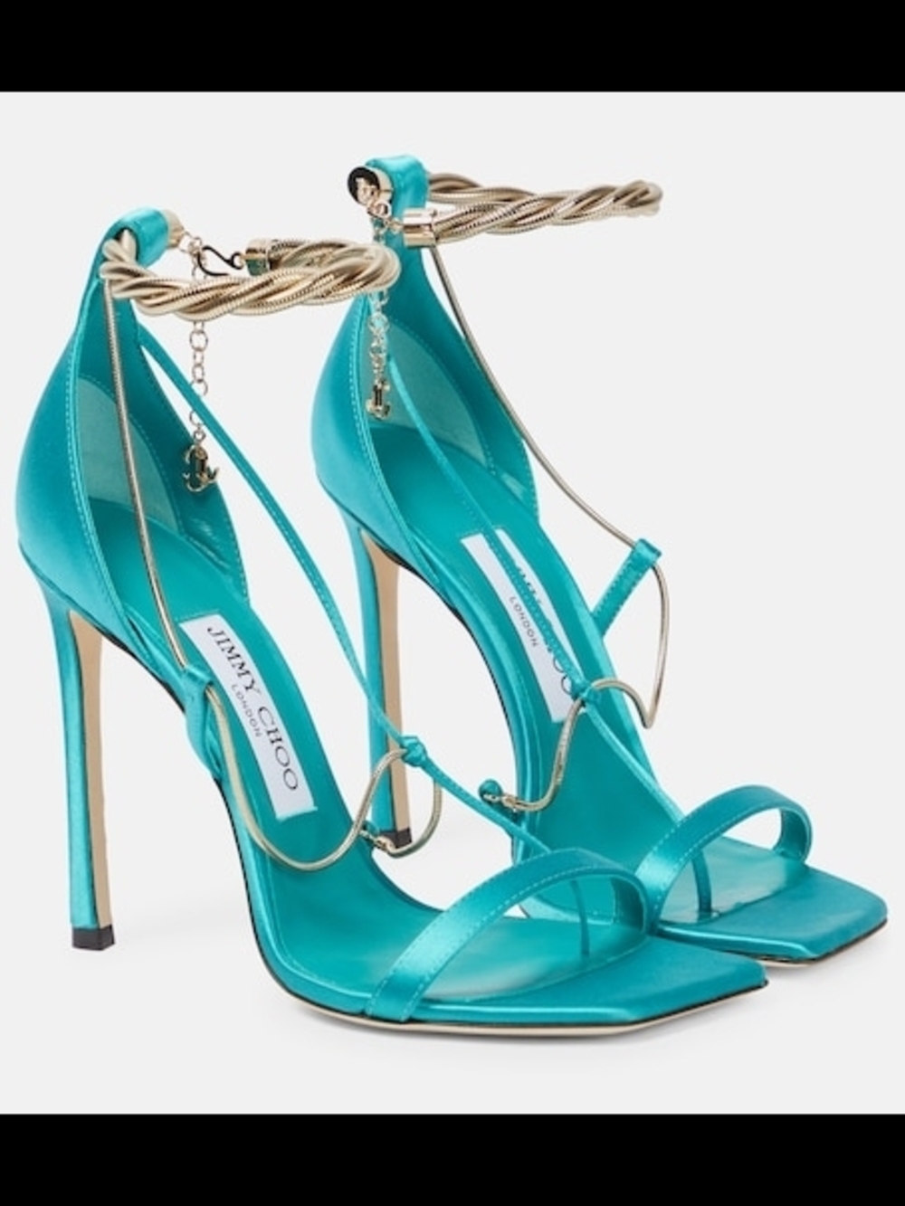 Jimmy Choo Oriana 110 satin sandals featuring gold-tone chain accents.